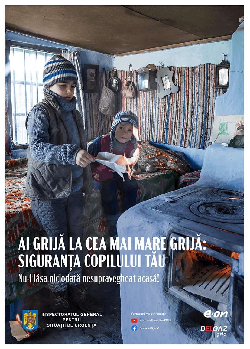Campania IGSU/E.ON — copii lângă sobă cu hârtie aprinsă